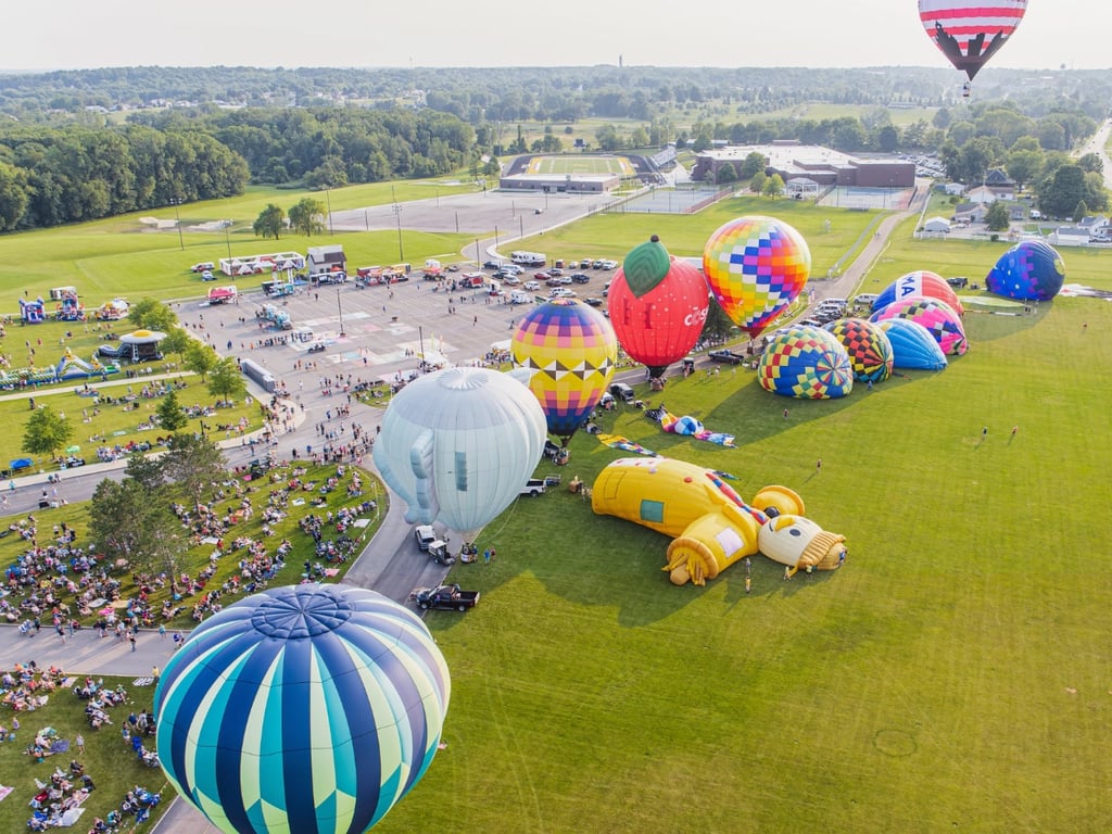 Hot air balloon taking off from the launch field