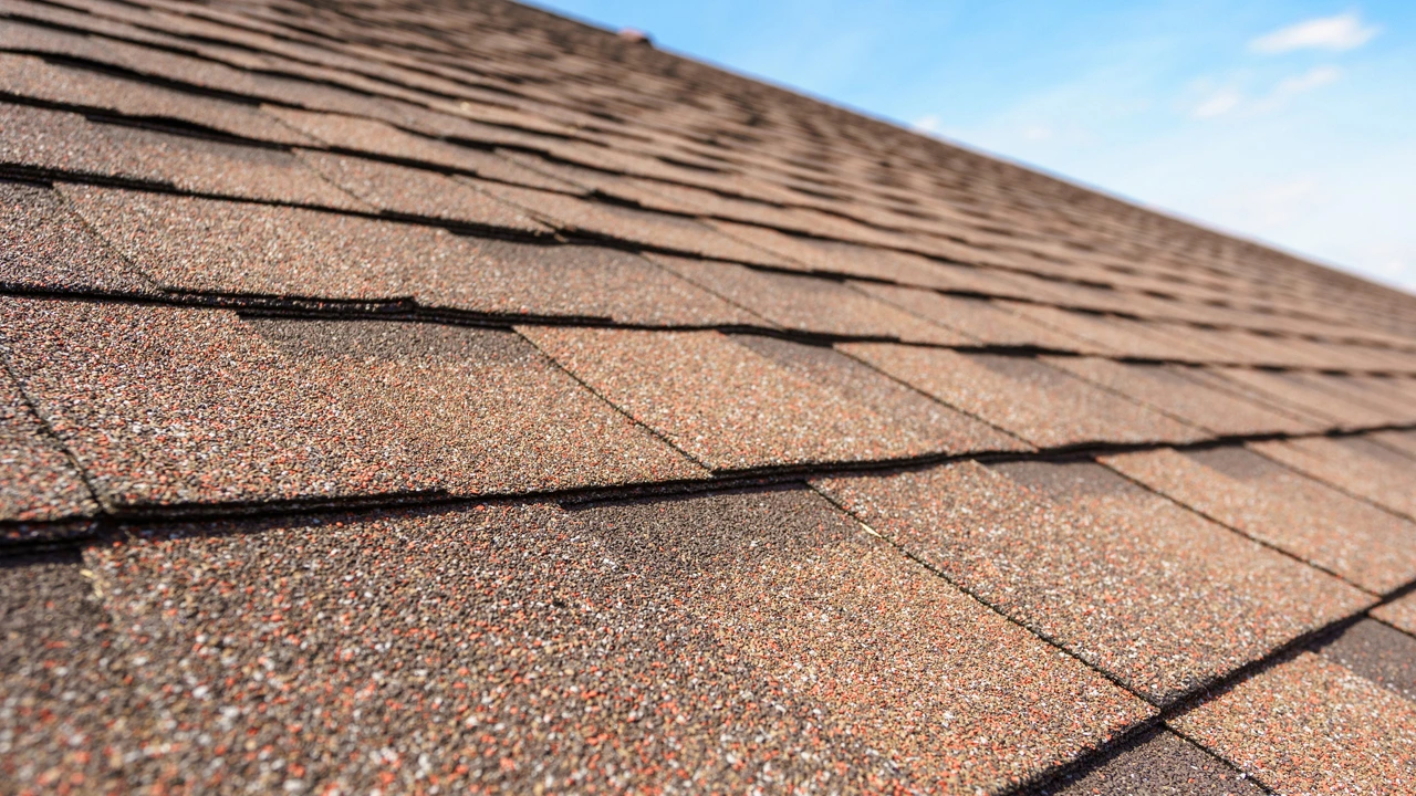 Architectural asphalt shingle installation close-up