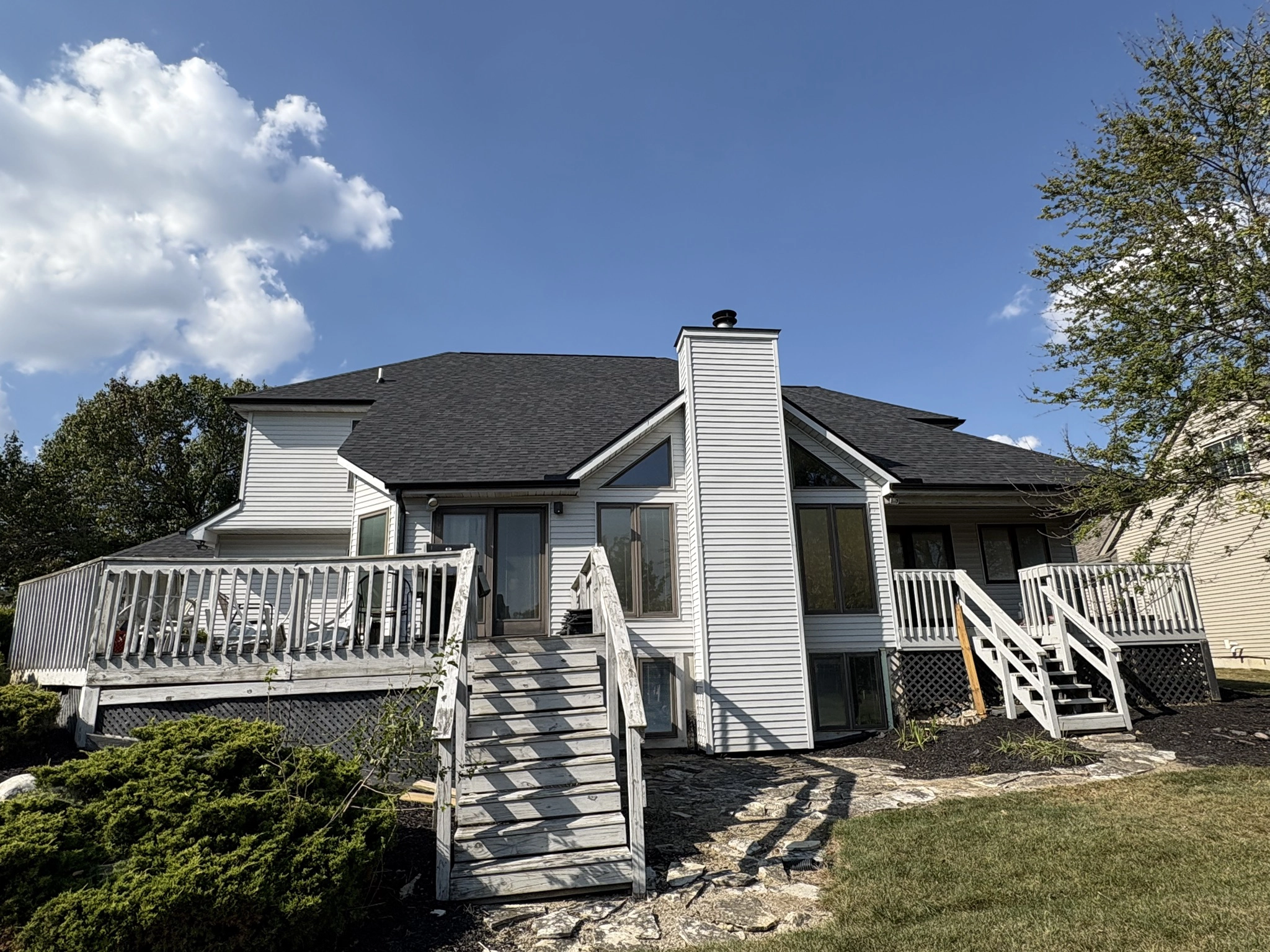 Completed residential roof with architectural shingles