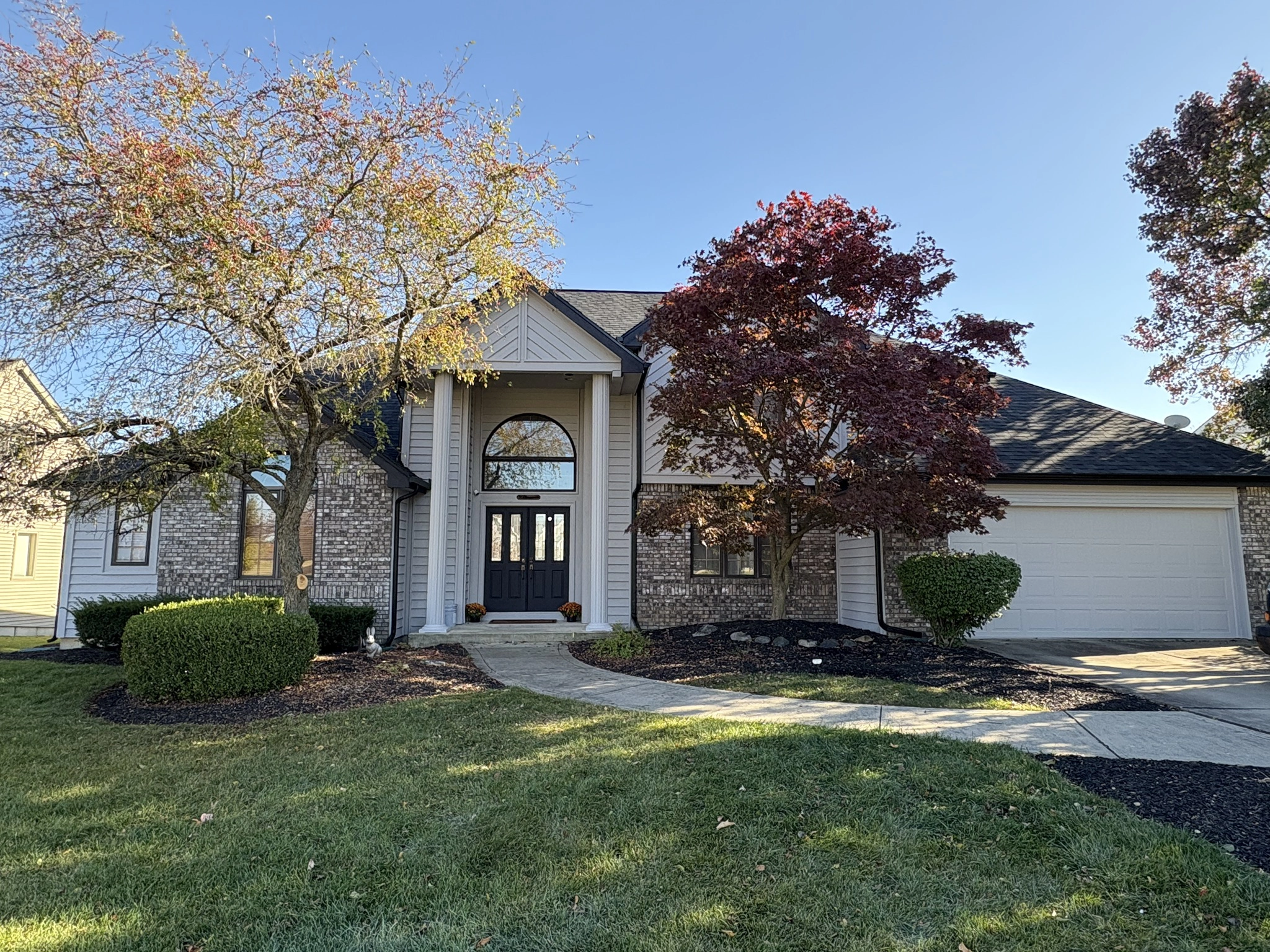 Home with dark architectural shingle roof
