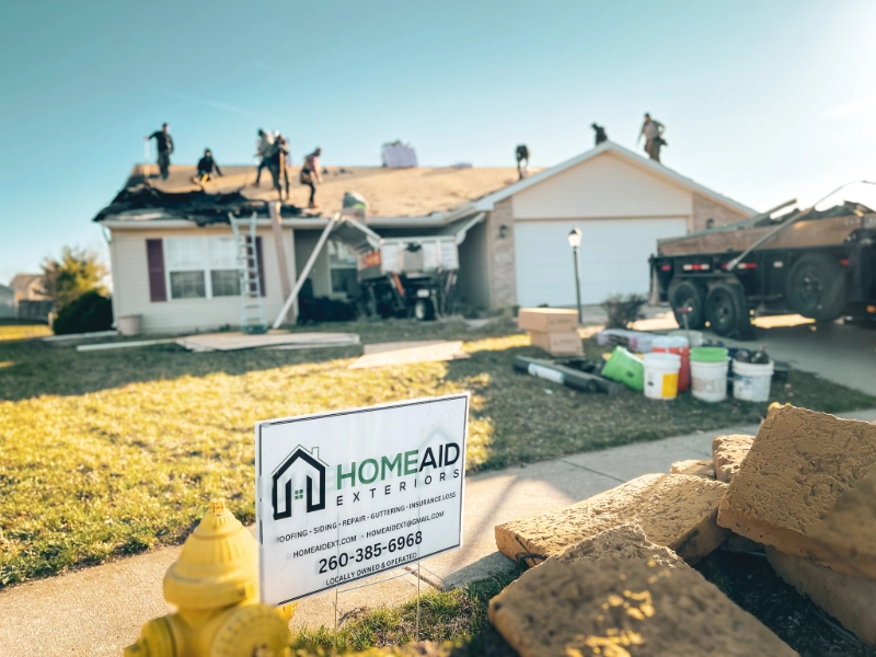 HomeAid Exteriors roofing crew performing roof replacement in Fort Wayne