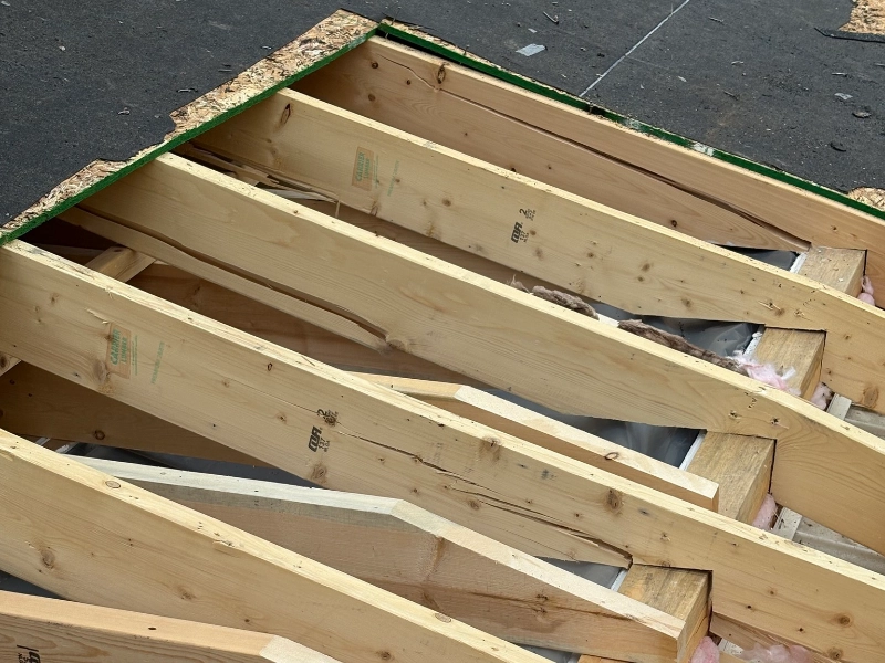 Storm damage on residential roof requiring replacement